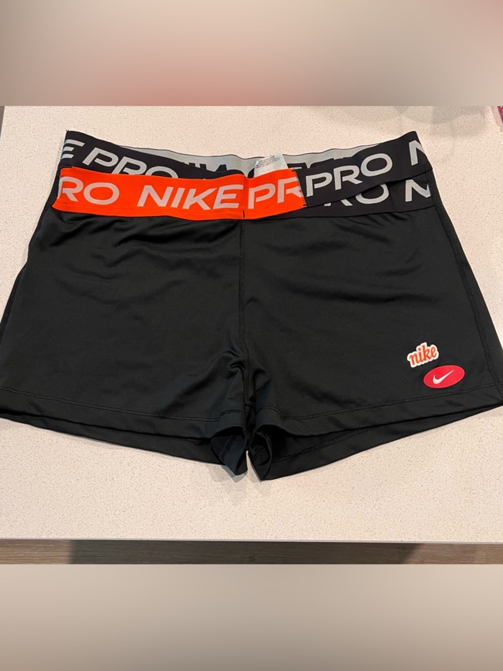 Nike Black Compression Shorts with Orange Waistband